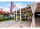 Backyard patio area with comfortable seating and a decorative covering, ideal for outdoor living at 4202 N 74Th Dr, Phoenix, AZ 85033