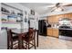 Dining room with a dark wood table and chairs connected to the kitchen at 4202 N 74Th Dr, Phoenix, AZ 85033