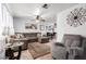 Cozy living room featuring a comfortable sectional, ceiling fan, and decorative rug at 4202 N 74Th Dr, Phoenix, AZ 85033