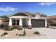 Charming single-story home with a two-car garage and inviting front porch at 42490 W Vincent Dr, Maricopa, AZ 85138