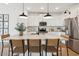 Spacious kitchen island with seating, pendant lighting, and modern stainless steel appliances at 42490 W Vincent Dr, Maricopa, AZ 85138