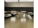 Well-lit parking garage with visible parking spots and various vehicles parked within the property at 425 S Parkcrest -- # 323, Mesa, AZ 85206