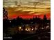 Exterior showing silhouettes of buildings and mountain range against a vivid red and orange sunset sky at 425 S Parkcrest -- # 323, Mesa, AZ 85206