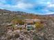 Sweeping view of the mountainside property showcasing a custom backyard with a pool, patio, and desert landscaping at 42613 N 111Th Pl, Scottsdale, AZ 85262