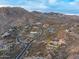 Desert homes with pools winding roads and majestic mountain backdrop at 42613 N 111Th Pl, Scottsdale, AZ 85262