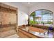 Luxury bathroom featuring a jetted tub with scenic views and a separate tiled walk-in shower at 42613 N 111Th Pl, Scottsdale, AZ 85262