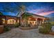 An immaculate outdoor living space with manicured landscaping and a view of the sunset at 42613 N 111Th Pl, Scottsdale, AZ 85262