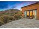 Beautifully landscaped patio with desert views and mountain backdrop creates a peaceful outdoor living space at 42613 N 111Th Pl, Scottsdale, AZ 85262