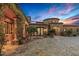 Elegant home featuring a stone and stucco exterior, beautiful landscaping, and a charming central fountain at 42613 N 111Th Pl, Scottsdale, AZ 85262