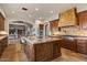 Kitchen with a large center island, stainless steel appliances and stone accents at 42613 N 111Th Pl, Scottsdale, AZ 85262