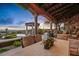 Elegant covered patio with scenic mountain views and outdoor seating at 42613 N 111Th Pl, Scottsdale, AZ 85262