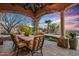 The perfect outdoor living space with a built-in patio, columns and views of the hills at 42613 N 111Th Pl, Scottsdale, AZ 85262