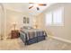 Cozy bedroom with a ceiling fan, window, and neutral wall color at 4365 E Anderson Dr, Phoenix, AZ 85032