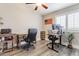 Functional home office with two desks and natural light at 4365 E Anderson Dr, Phoenix, AZ 85032