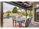 Charming covered patio overlooking the pool, perfect for outdoor dining and entertaining at 4365 E Anderson Dr, Phoenix, AZ 85032