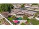 Stunning aerial view of home with backyard pool, patio and green space at 4503 E Elmwood St, Mesa, AZ 85205