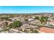 Panoramic aerial view of a residential community featuring homes, tree lined streets, and mountain views at 4503 E Elmwood St, Mesa, AZ 85205