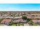 Expansive aerial view of a residential community showcasing well-maintained homes, streets and landscaping at 4503 E Elmwood St, Mesa, AZ 85205