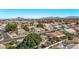 Expansive aerial view of a neighborhood with mountain backdrop on a clear day at 4503 E Elmwood St, Mesa, AZ 85205