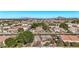 Panoramic aerial view of a residential community with homes, tree lined streets and distant mountain views at 4503 E Elmwood St, Mesa, AZ 85205