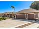 Spacious driveway leading to a two-car garage and a charming single-story home at 4503 E Elmwood St, Mesa, AZ 85205