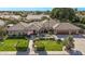 Stunning aerial view of a single-Gathering home showcasing lush landscaping, mature trees and a charming flag at 4503 E Elmwood St, Mesa, AZ 85205