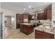 Beautiful kitchen with granite countertops, stainless steel appliances, and dark wood cabinetry at 4503 E Elmwood St, Mesa, AZ 85205