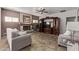 Comfortable living area with fireplace, media cabinet, tile flooring, and neutral color scheme at 4503 E Elmwood St, Mesa, AZ 85205