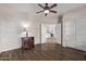 Bright living room with wood-look tile, ceiling fan, and open doorway at 4503 E Elmwood St, Mesa, AZ 85205