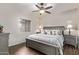 Tranquil main bedroom with wood-look floors and a large window at 4503 E Elmwood St, Mesa, AZ 85205