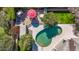 Aerial close up of backyard pool and patio area surrounded by greenery at 4503 E Elmwood St, Mesa, AZ 85205