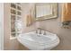 Close up of bright powder room with vessel sink and accent lighting at 4503 E Elmwood St, Mesa, AZ 85205