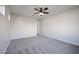 Spacious bedroom featuring neutral walls, plush carpeting, and a modern ceiling fan at 4514 W Ellis St, Laveen, AZ 85339