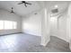 Open-concept living room featuring archways, neutral paint, wood-look tile and ceiling fans at 4514 W Ellis St, Laveen, AZ 85339