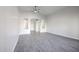 Bright living room featuring archways, neutral paint, wood-look tile and ceiling fan at 4514 W Ellis St, Laveen, AZ 85339