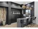 Stylish bar with dark cabinetry, pendant lighting, and a modern countertop at 4602 E Oberlin Way, Cave Creek, AZ 85331