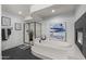 Modern bathroom featuring a soaking tub, a glass shower and modern decor at 4602 E Oberlin Way, Cave Creek, AZ 85331