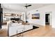 Open-concept living room with hardwood floors, modern decor, and views into the kitchen and dining spaces at 4602 E Oberlin Way, Cave Creek, AZ 85331