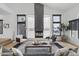 Bright living room with vaulted ceilings, modern fireplace, and ample natural light at 4602 E Oberlin Way, Cave Creek, AZ 85331