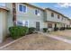 Charming two-story townhouse with nicely landscaped front yard and inviting entrance at 4703 N 26Th Ln, Phoenix, AZ 85017