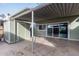 View of the patio with an awning and storage shed, ideal for outdoor relaxation and storage at 4703 N 26Th Ln, Phoenix, AZ 85017