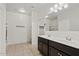 Bright bathroom with double sink vanity and tile flooring at 4718 E Pearl Rd, San Tan Valley, AZ 85143