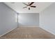 Bedroom with a ceiling fan and a large window providing natural light at 4718 E Pearl Rd, San Tan Valley, AZ 85143