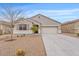 Charming single-story home featuring desert landscaping, neutral stucco, and attached two-car garage at 4718 E Pearl Rd, San Tan Valley, AZ 85143