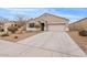 Charming single-story home with a two-car garage and low maintenance desert landscaping at 4718 E Pearl Rd, San Tan Valley, AZ 85143