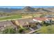 Gorgeous home with desert landscaping near a golf course and mountain backdrop at 4820 N 210Th Ave, Buckeye, AZ 85396