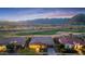 Beautiful front yard with a golf course in the background and a view of the mountains at 4820 N 210Th Ave, Buckeye, AZ 85396