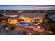 Aerial view of a private backyard with a pool, spa, outdoor kitchen and covered patio at 4820 N 210Th Ave, Buckeye, AZ 85396