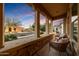 Relaxing front porch with stone accents and comfortable seating at 4820 N 210Th Ave, Buckeye, AZ 85396