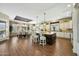 Spacious kitchen boasts a center island with barstool seating and connects to a formal dining area at 4820 N 210Th Ave, Buckeye, AZ 85396